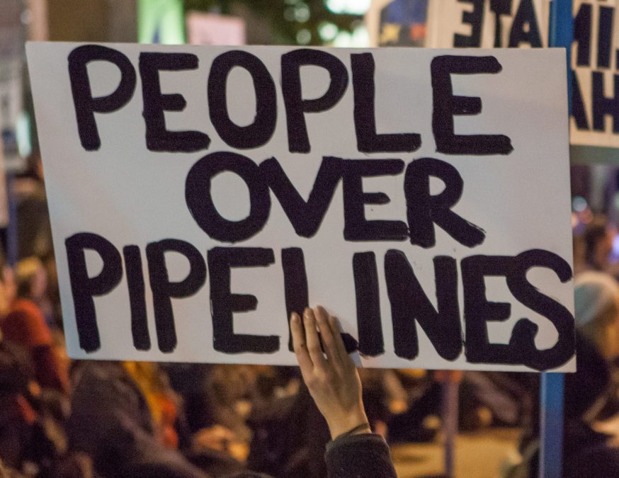 protest sign reading People Over Pipelines