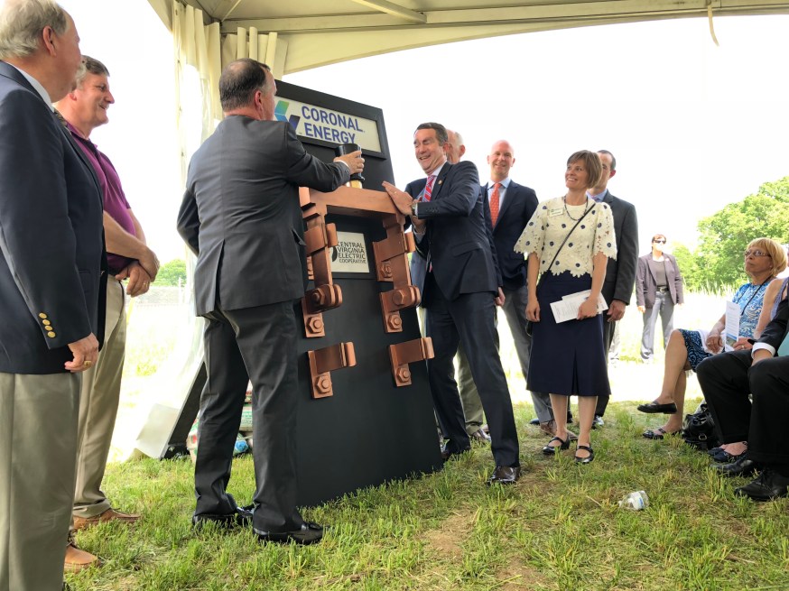 Governor Northam and CVEC CEO Gary Wood flip the switch on a solar farm